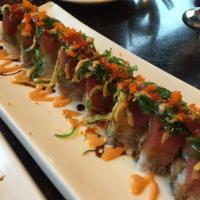 Poison Ivy Roll · Shrimp tempura, snow crab meat and cucumber inside topped with tuna, avocado, masago and sea...