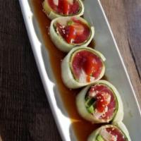 Lollipop Roll · Six pieces. Tuna, yellowtail, snow crab legs and avocado wrapped with thinly peeled cucumber...