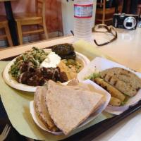 Mediterranean Plate · A combination of hummus, tabouleh, falafel, dolma and feta cheese.