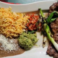 Carne Asada · Steak served with rice, beans, pico de gallo, guacamole and green onions. Specialties served...