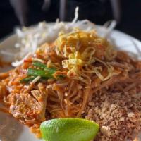 Pad Thai Noodle · Traditional Thai noodle stir fried with egg, bean sprout, green onions, red tofu and ground ...