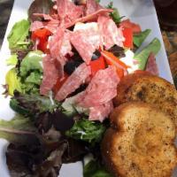 Mediterranean Salad · Organic mixed greens with feta cheese, roasted peppers, black olives, tomatoes and salami wi...