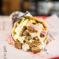 Lamb Gyro · Ground lamb mixed with a selection of the finest herbs and spices, cooked as perfect tender ...