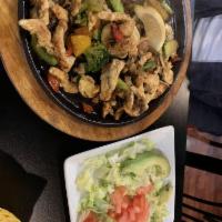 Fit Fajitas · Sizzling perfectly grilled onions, tomatoes and green peppers with choice of steak or grille...