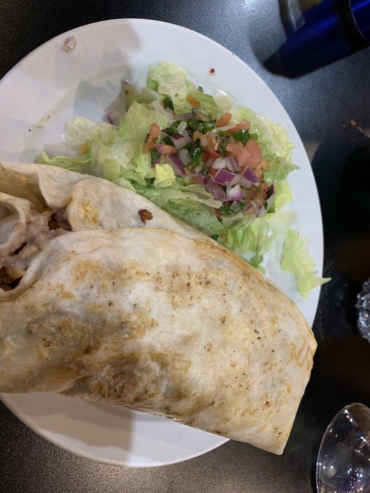 Super Burrito · Amazing flavor fusion! This grilled ground beef and chorizo mixed with rice, beans, cheese and spicy salsa is served with lettuce and pico de gallo. 