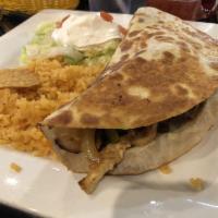 Fajita Quesadilla · The most popular quesadilla, filled with quality melted cheese, choice of steak, grilled chi...