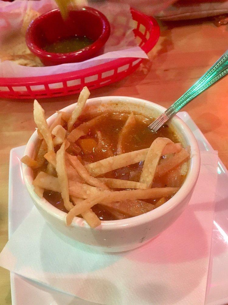 Chicken Tortilla Soup · Made with chicken, cheddar and chihuahua cheese, roasted corn, carrots, cilantro, spices in a vegetable broth and served with crisp corn tortilla strips. 