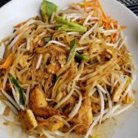 Pad Thai · Rice noodles with tofu, egg, carrots, beansprouts, scallions and crushed peanuts in a Thai s...