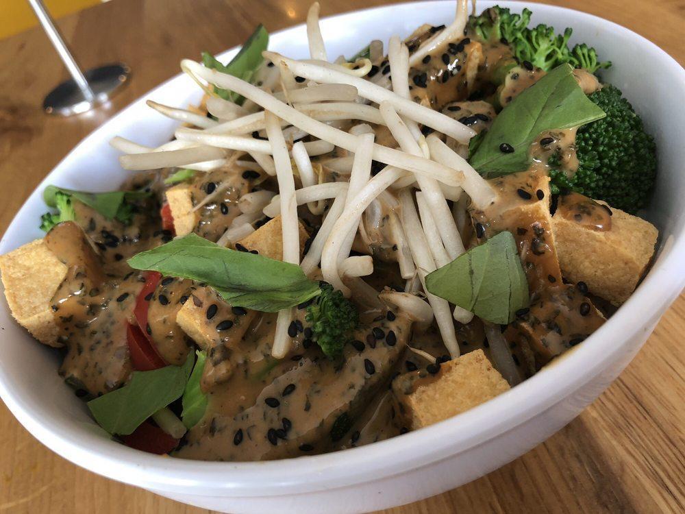 Thai Temple Bowl · Assortment of veggies served over a bed of organic brown rice covered in our house-made Thai basil peanut sauce. Topped with bean sprouts, black sesame seeds and fresh basil.
