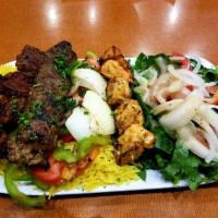 Afandina Mix Grill Special · Chicken kabab, shish kabab, kofta, rice, and salad.