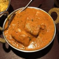Chicken Tikka Masala · Traditional chicken entree prepared in tomato butter creamy sauce. White meat. Served with b...