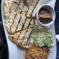 Quesadilla · Made with shredded chicken or ground beef and melted cheese.