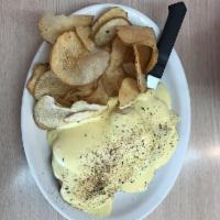 Eggs Benedict · 2 basted eggs, thin sliced ham on top of English muffin with light hollandaise sauce and spu...