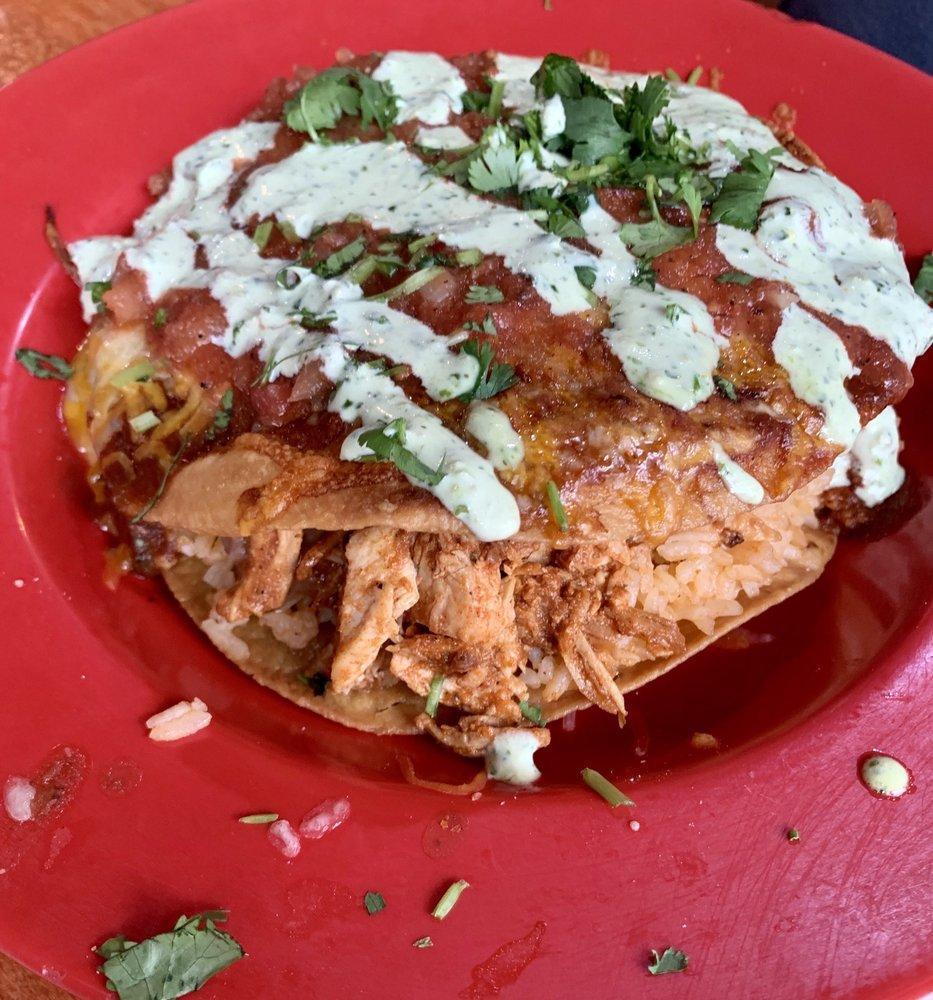 Mexican Pizza · A layer of rice and beans with your choice of meat sandwiched between two deep fried Tortillas and covered with topping of your choice.