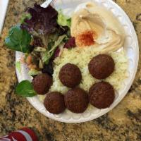 Falafel Plate · Chickpeas and broad beans mixed with spices and then fried. Served with rice, salad, hummus,...