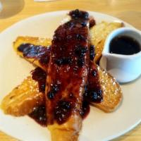 French Toast · 3 slices of french bread cooked in a house-made batter of egg, vanilla, and cinnamon stacked...