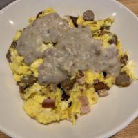 Gravy Scramble · A hearty serving of sausage, ham, mushroom and cheddar-jack cheese topped with peppered saus...