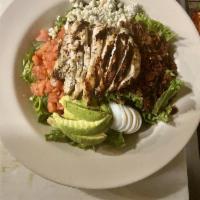 Chicken Cobb Salad · Fresh greens, grilled chicken breast, crisp bacon, tomato, bleu cheese crumbles, hard-cooked...