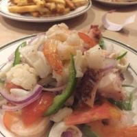 Seafood Salad · Calamari, octopus, shrimp, celery, tomatoes, and fresh pepper, with olive oil and lemon dres...
