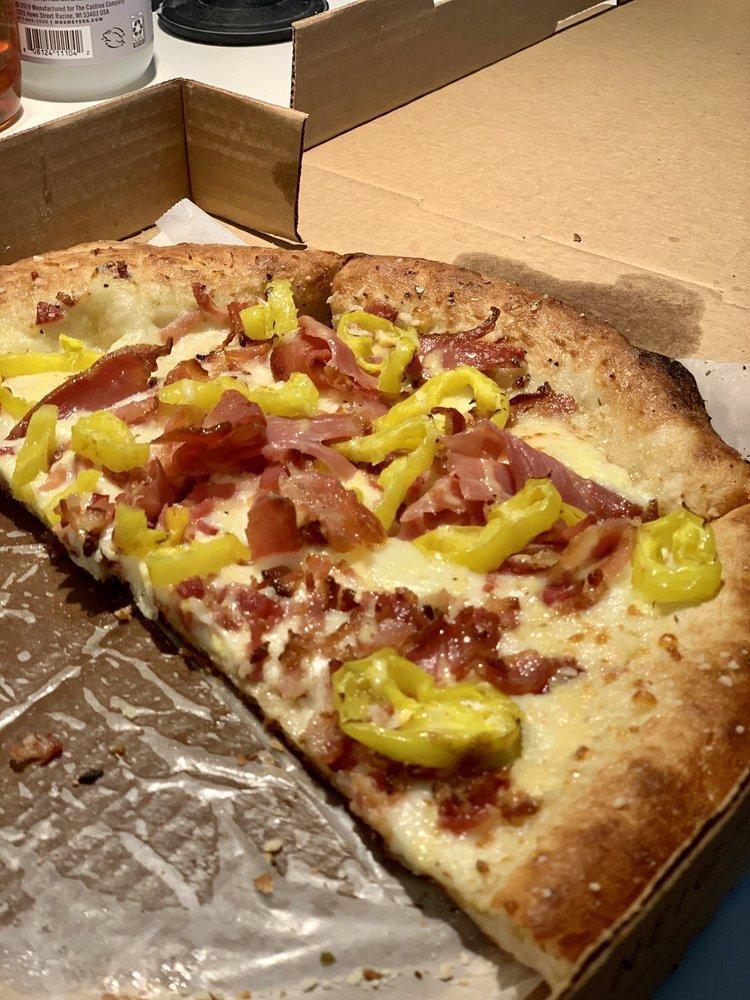 Italian Stallion Pizza · Extra virgin olive oil, bacon, prosciutto, banana peppers, feta, and a creamy Italian dressing swirl.