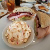 Tourist Tan · Applewood smoked bacon, smoked turkey, black forest ham. Topped with cranberry relish, rosem...