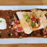 Caribbean Black Bean Chili · Black beans, and sausage, topped with sour cream and pico de gallo and green onions.