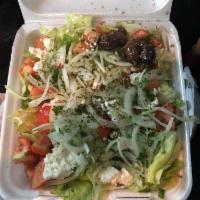 Greek Salad · Lettuce, tomatoes, black olives, onions and feta cheese, topped with oil and vinegar. 