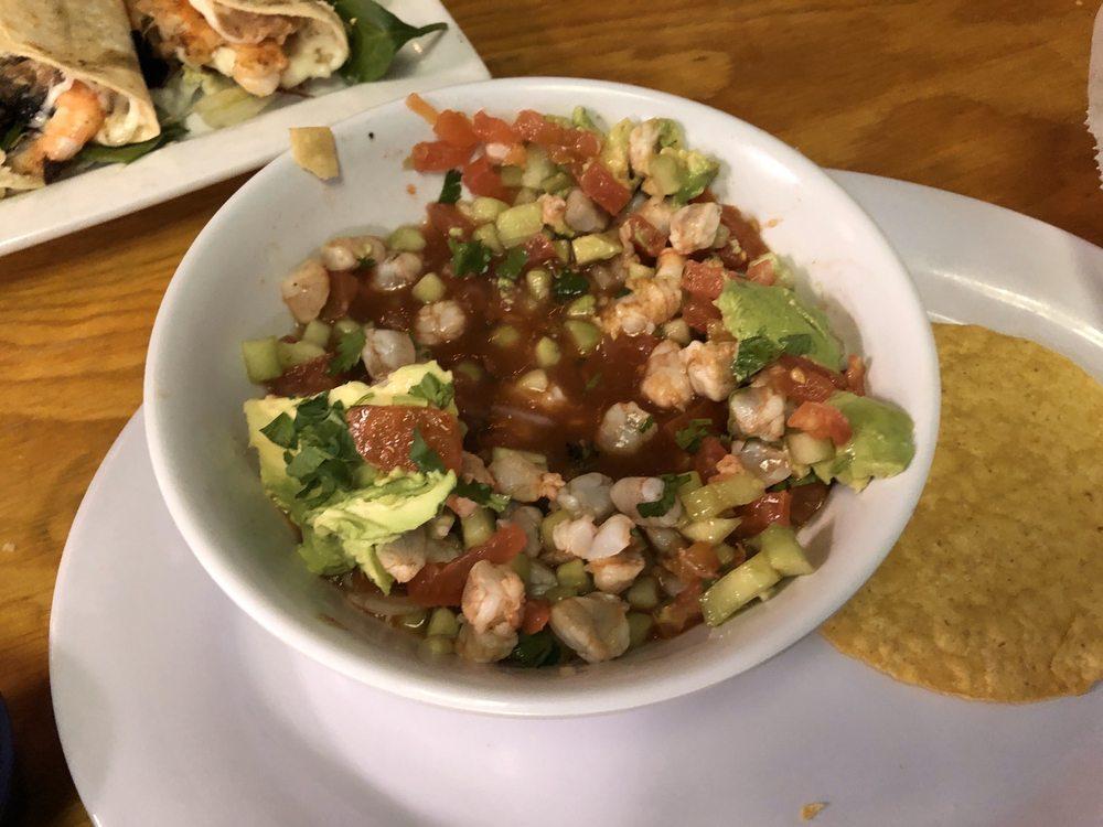 Shrimp Ceviche · Delicious shrimp marinated in lime juice served Sinaloa style cucumber, tomato, cilantro, and red onion with a splash of clamato.