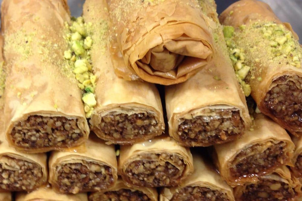 Baklava · Filo dough filled with walnuts and garnished with crushed pistachios and homemade syrup.