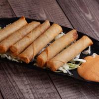 Lumpia · 6 pieces. Filipino style mini egg rolls filled with pork and veggies. Comes with a side of s...