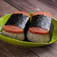 Spam Musubi · 2 pieces. Rice and spam wrapped tightly around with seaweed with sauce inside.