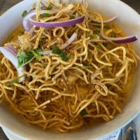 Kao Soi Chicken · Egg noodle in coconut milk, chicken, red onion topped with cilantro, crispy egg noodle, gree...