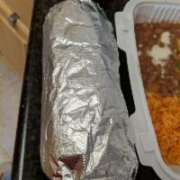 Super Burrito · Re-fried beans, rice, cheese, pico de gallo and sour creams.