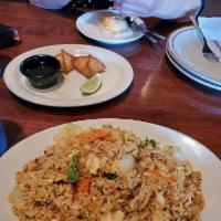 Spicy Fried Rice · Spicy fried rice cooked with onions, garlic, and your choice of chicken, beef, or pork. Shri...