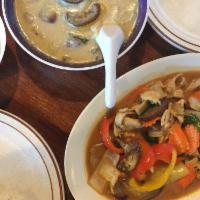 Green Curry · Eggplant, bell peppers, and bamboo, a settle yet spicy curry, your choice of chicken, beef, ...