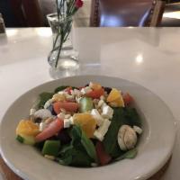 Spinach Salad · Baby spinach, black olives, tomatoes, cucumbers, feta cheese, orange slices and pine nute