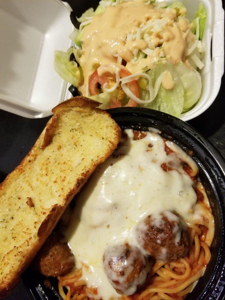 Spaghetti · Our authentic pasta sauce on a bed of spaghetti, covered with melted mozzarella and served with homemade meatballs. Served with salad and garlic bread.