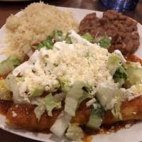 Enchiladas Suizas · House-made corn tortillas rolled up with choice of tinga de pollo, beef or vegetables served...