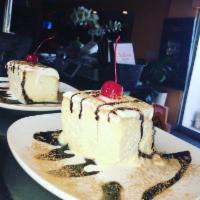 Tres Leches Cake · House made sponge cake soaked in three types of milk.