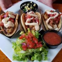 Blackened Shrimp Tacos · House-made Masa taco shells, served with coleslaw, pico, chipotle mayonnaise, and side of gu...