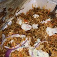 Chicken Biryani · Marinated chicken cooked with basmati rice & spices