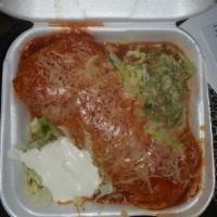 Wet Burrito · Cheese, lettuce, gucamole, sour cream, rice, and beans.