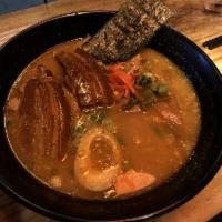 Tonkotsu Ramen · Come with pork shoulder, bamboo, black mushroom, half slow cook egg, green onion. Select spi...
