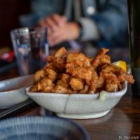 Chicken Karaage · Served deep-fried small chicken pieces with homemade spicy sauce.