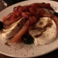 Caprese Salad · Tomato, fresh mozzarella, basil, roasted peppers, extra virgin olive oil, and balsamic drizz...