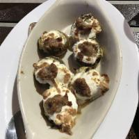 Stuffed Mushrooms · Mushrooms stuffed with our delicious spinach dip layered with fresh melted mozzarella and sa...