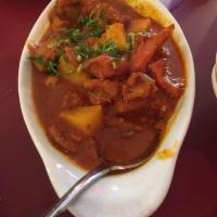Chicken Vindaloo · Chicken cooked in rich spicy tangy gravy with curry leaves, potatoes and coconut milk.