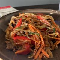 Japchae · Glass noodles, red pepper, carrots, onions, spinach,
mushrooms and thinly sliced marinated b...