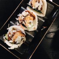 3 Piece Pork Buns · Steamed wheat buns with slices of savory pork belly. Topped with cucumbers, coleslaw and kat...