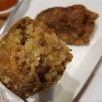 Kwa Kwa Bao · Crispy chicken skin surrounds savory sticky rice with pork and shiitake mushroom.